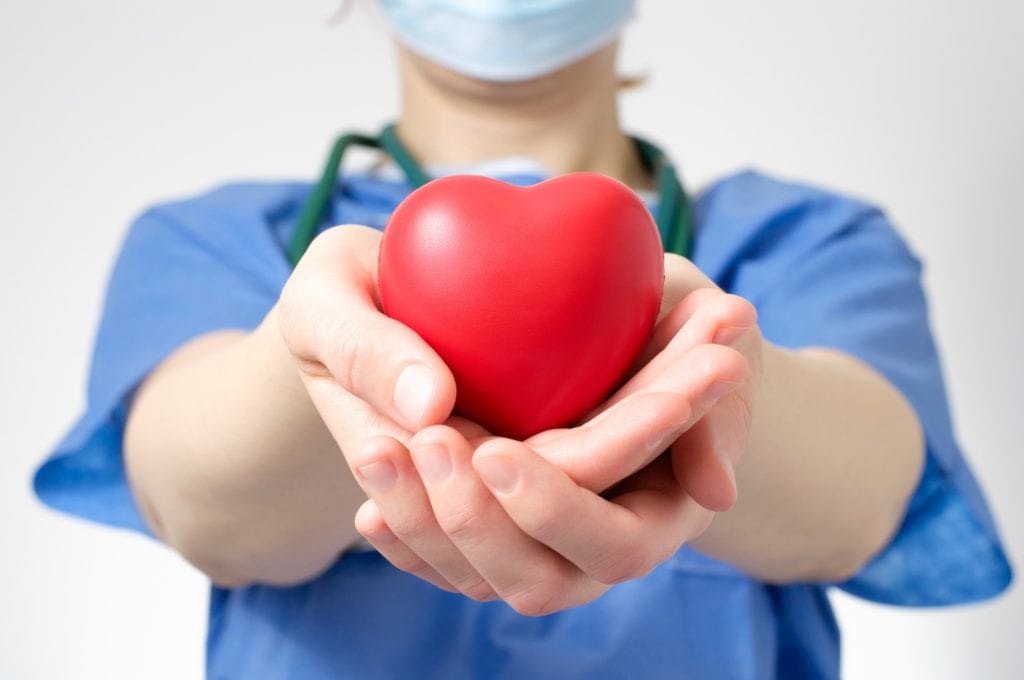 Doctor holding a foam heart