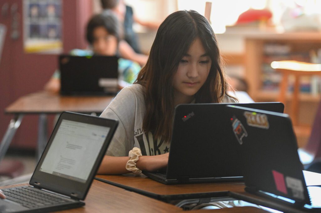 student working on a device